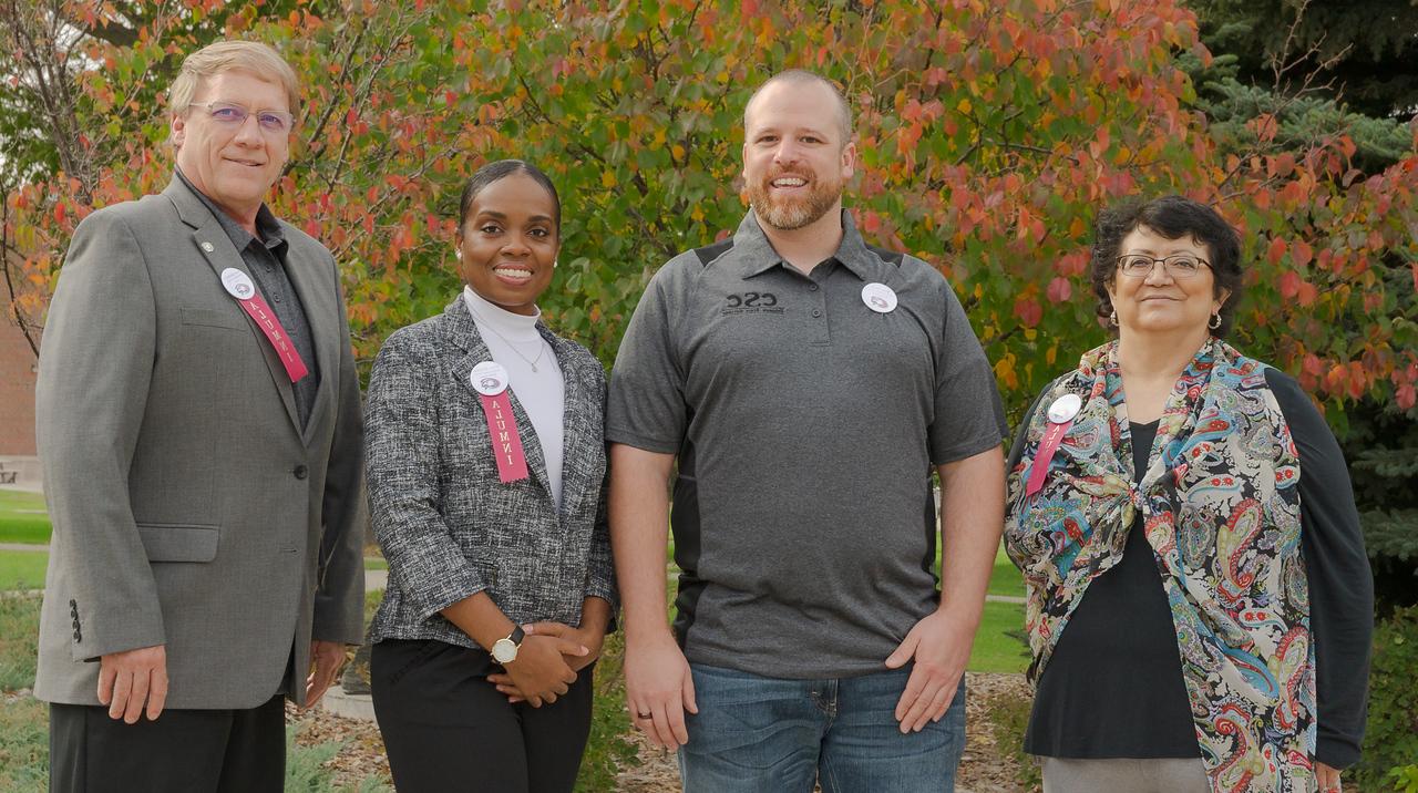 Shown are Distinguished Alumni Award recipients Dora Olivares, right, and Mark Brohman, left. In the center are two of the Distinguished Young Alumni Award recipients, Ryan Hieb and Nisha Durand.